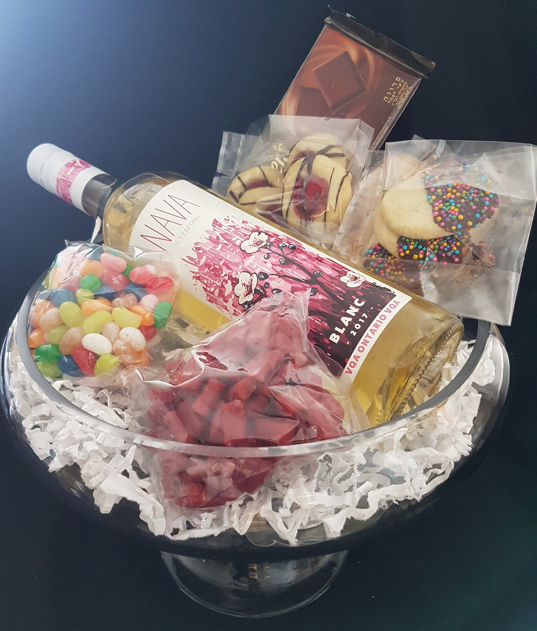 Modern gift filled with wine and sweets